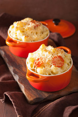 baked macaroni with cheese in orange casserole