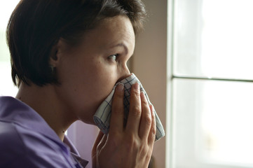 Woman feels sickness at home