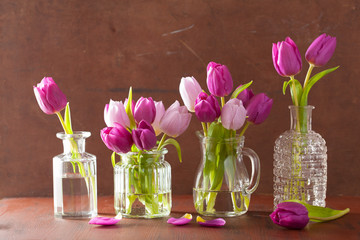 beautiful purple tulip flowers bouquet in vases © Olga Miltsova
