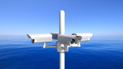Security surveillance cameras on blue sky and sea background