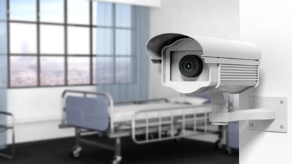 Security surveillance camera on wall in a hospital room