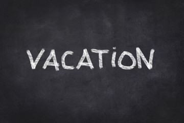 Obraz premium vacation - handwritten on chalkboard