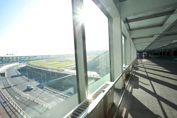 Sunny on modern glass office windows building interior corridor