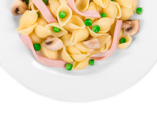 Pasta ribbons with vegetables on white plate.