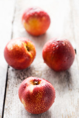 nectarines on wooden background