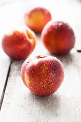 nectarines on wooden background