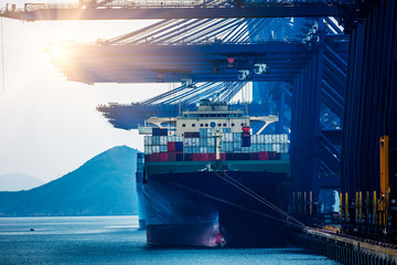 Cargo ship in the harbor at sunset