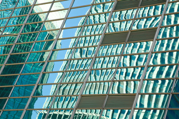 Obraz premium Modern office architectur at blue glass wall backgrounds