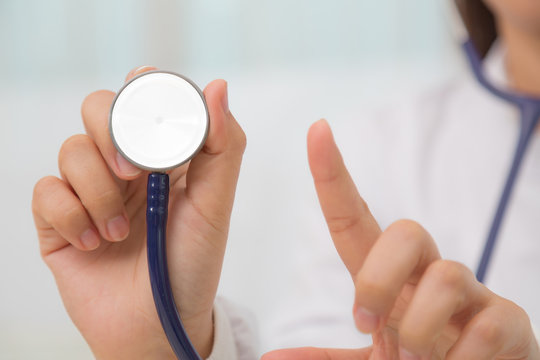 Doctor with stethoscope in the hands