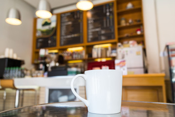 Coffee cup on table in cafe
