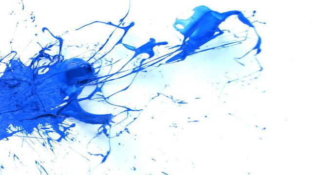 Blue paint splattering on white background