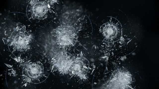 Bullets shatter glass, slow motion