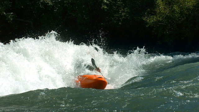 Kayaking in white water, super slow motion