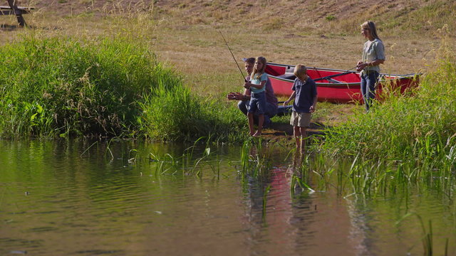 Family Hanging Out At Lake