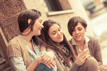 Obraz premium Group of Women Sending Message with Mobile Phone