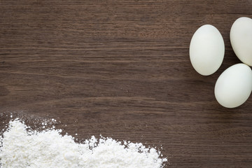 cooking background, eggs and flour on desk