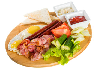 Toasts, fried egg, sausages, meat and vegetables
