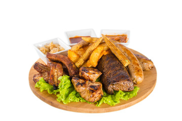 Roasted meat, sausages with corn and sauce
