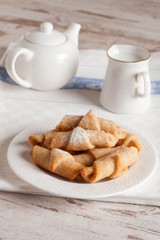 fresh Breakfast with croissants and milk on a white wood backgro