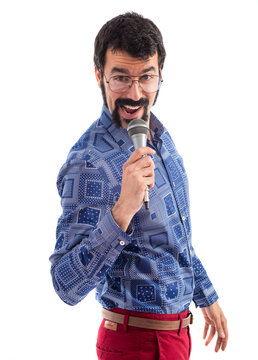 Vintage young man singing with microphone