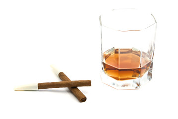 two cigarillos and glass of cognac