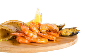 Shrimps, mussels, fish with lemon
