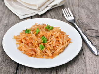 Stew cabbage on wooden table