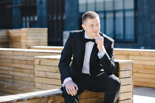 Maxim photo session model in tuxedo outdoors