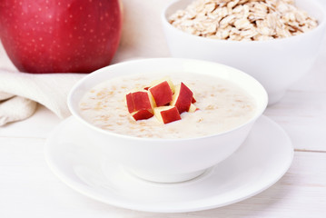 Oat porridge with red apple slices