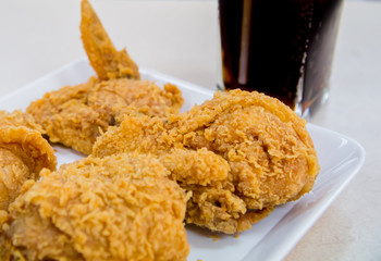 Crispy fried chicken with glass of cola