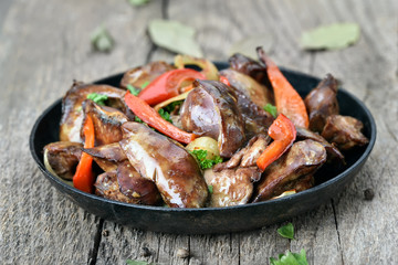 Grilled chicken liver in frying pan
