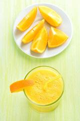 Fototapeta na wymiar Orange smoothie in glass