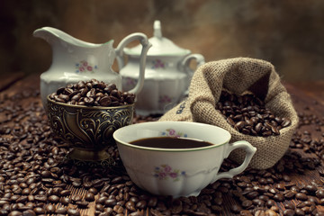 Coffee cup, beans and canvas sack
