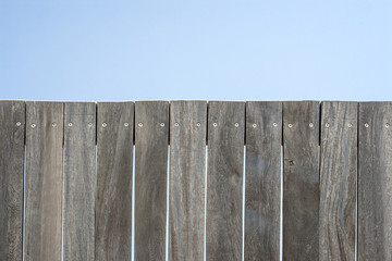 wooden planks wall and blue sky