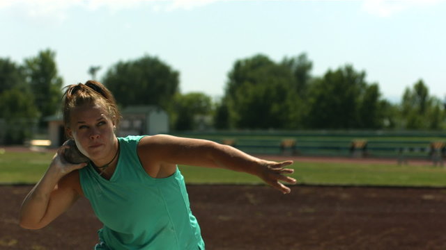 Track and Field athlete doing shot-put, slow motion