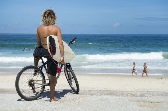 Brazilian Surfer on Bike Ipanema Beach Rio Brazil - Powered by Adobe