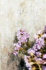 Closeup of dry flowers composition  wooden background.