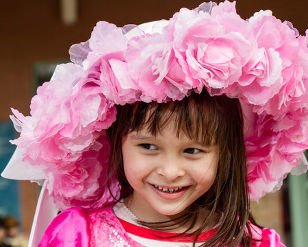 Young girl in pink flower hat