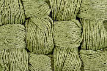 Green twisted skeins of floss as background texture
