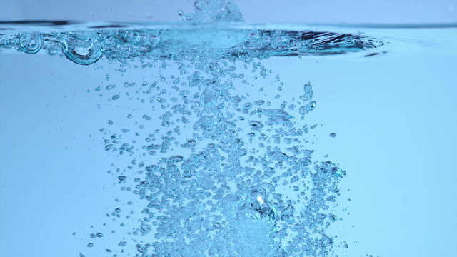 Underwater splash and bubbles in slow motion
