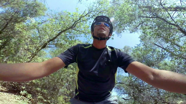 POV action camera shot of Man riding mountain bike
