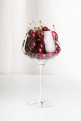 Red cherries in a wineglass