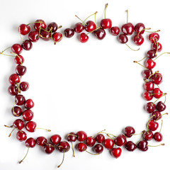 Red cherries on a white background