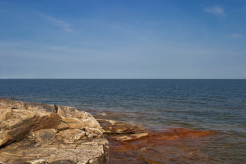 Fototapeta na wymiar Rocky coastline at the sea archipelago