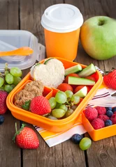 Gordijnen Lunch box with sandwich, cookies, veggies and fruits © kate_smirnova
