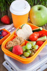 Lunch box with sandwich, cookies, veggies and fruits © kate_smirnova