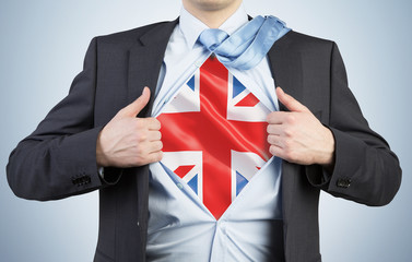 A man tearing the shirt. Great Britain flag on the chest.