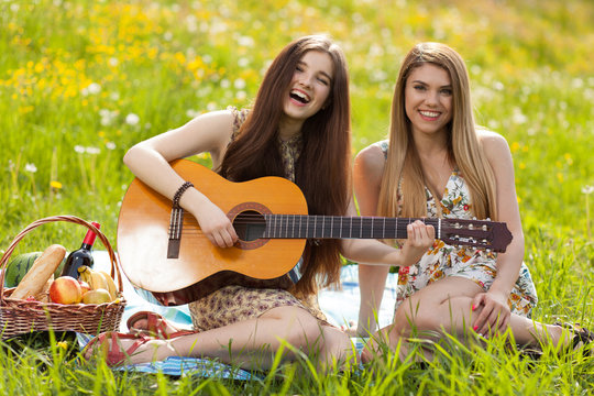Two beautiful young women on a picnic
