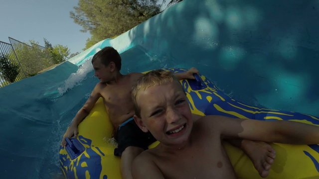 Kids Going Down A Waterslide At Waterpark, POV Video