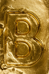 Golden letter B